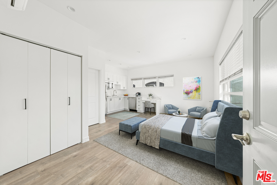 a bedroom with a bed and a cabinets