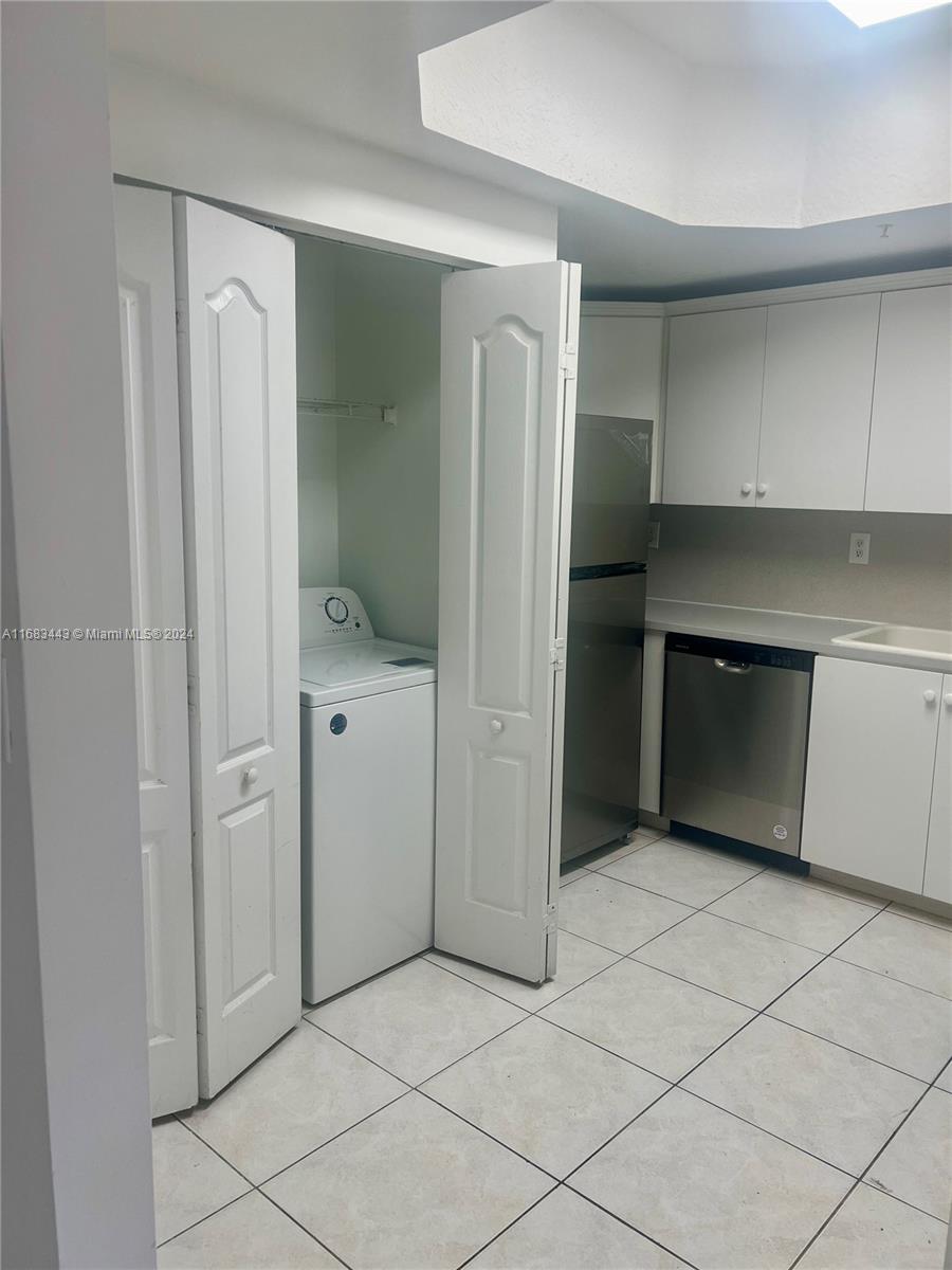 a spacious bathroom with a shower and a sink