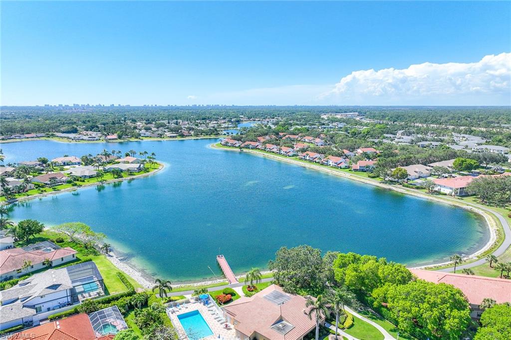 an aerial view of a houses with a lake view