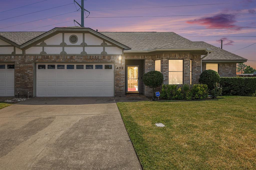 front view of a house with a yard