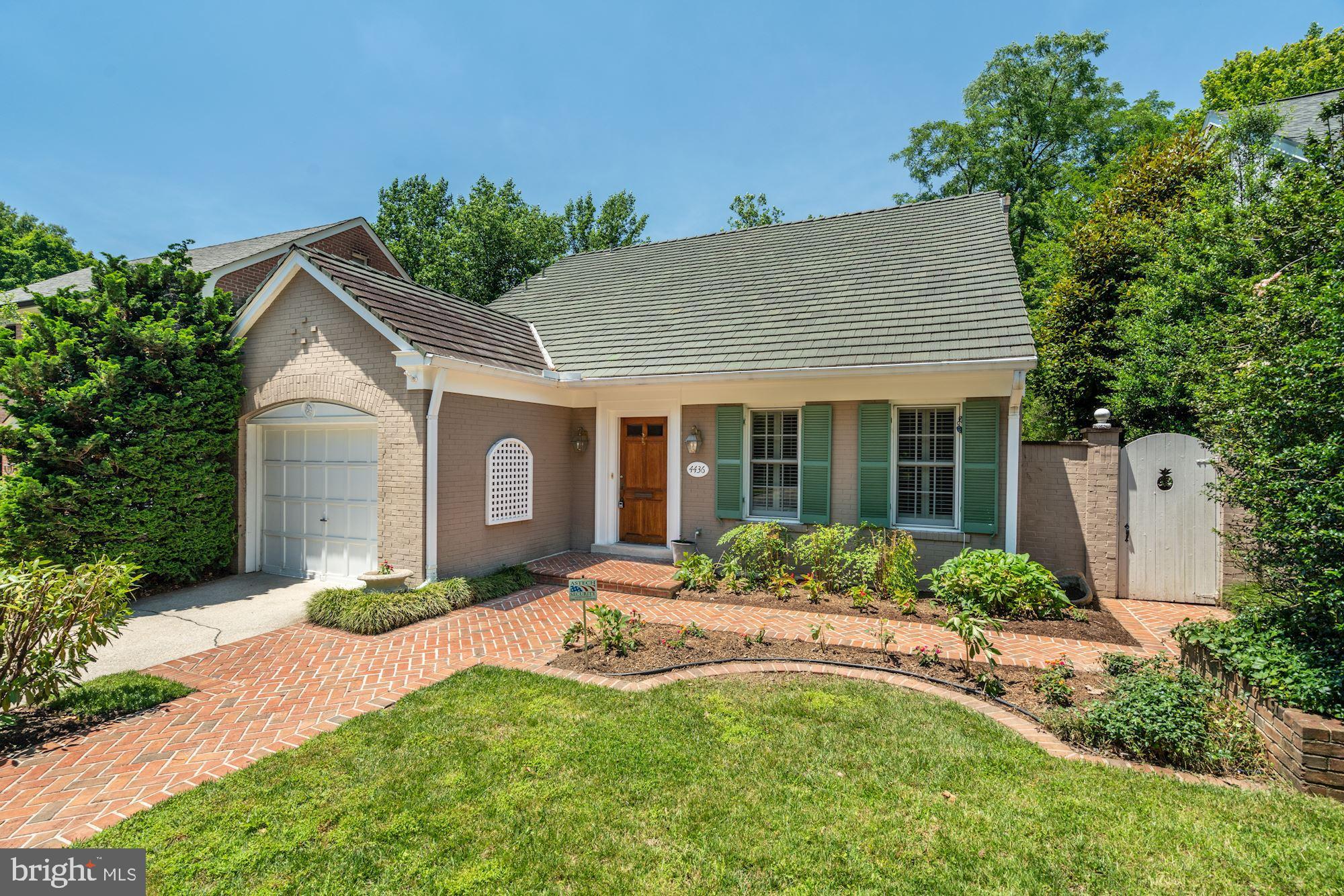 a front view of a house with a yard and porch