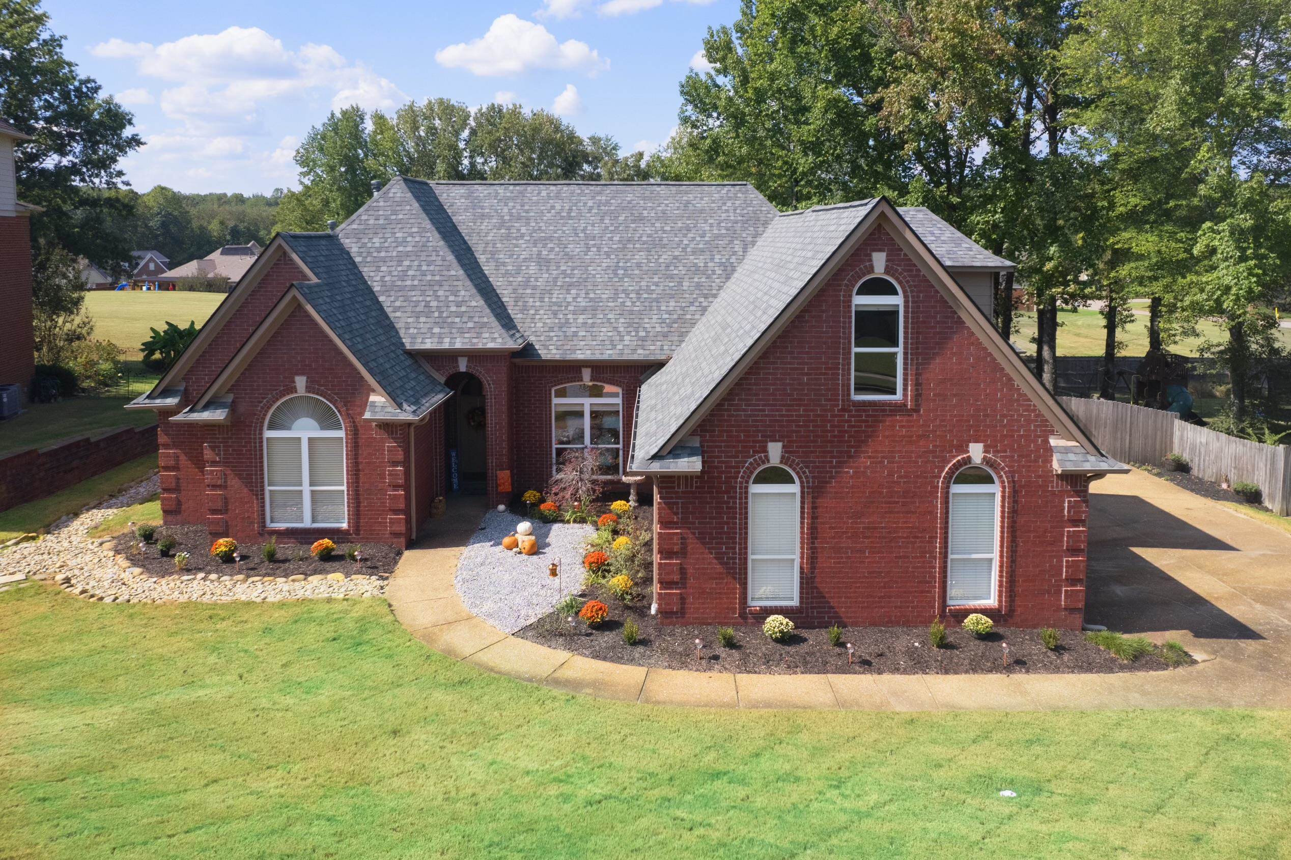 a front view of a house with a yard