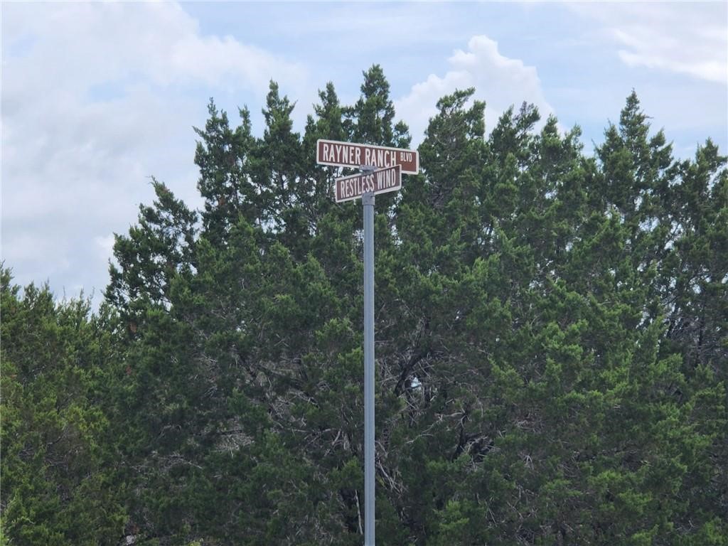 a street sign on a pole on a road