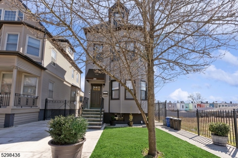 a view of a house with a yard