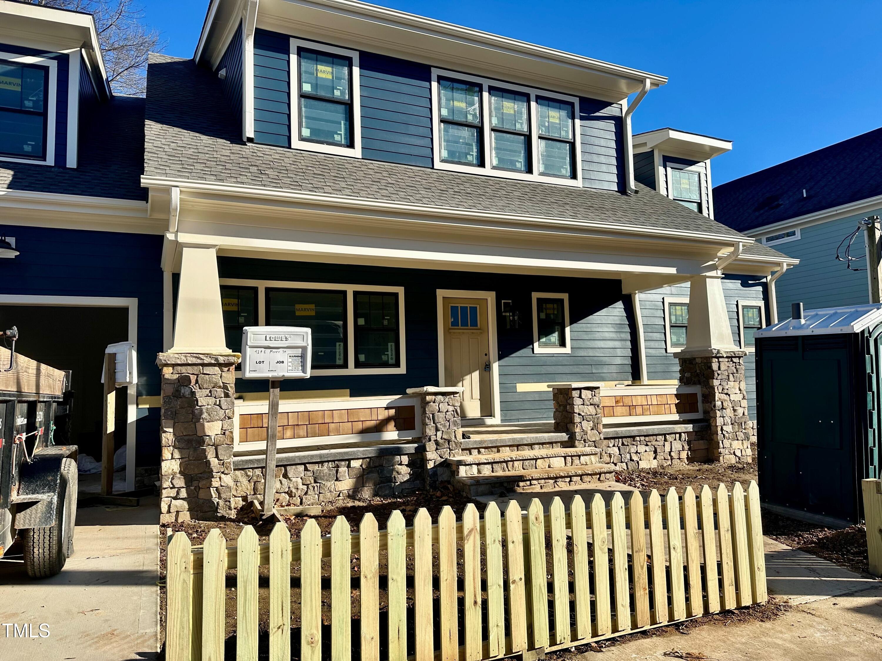 a front view of a house with glass windows