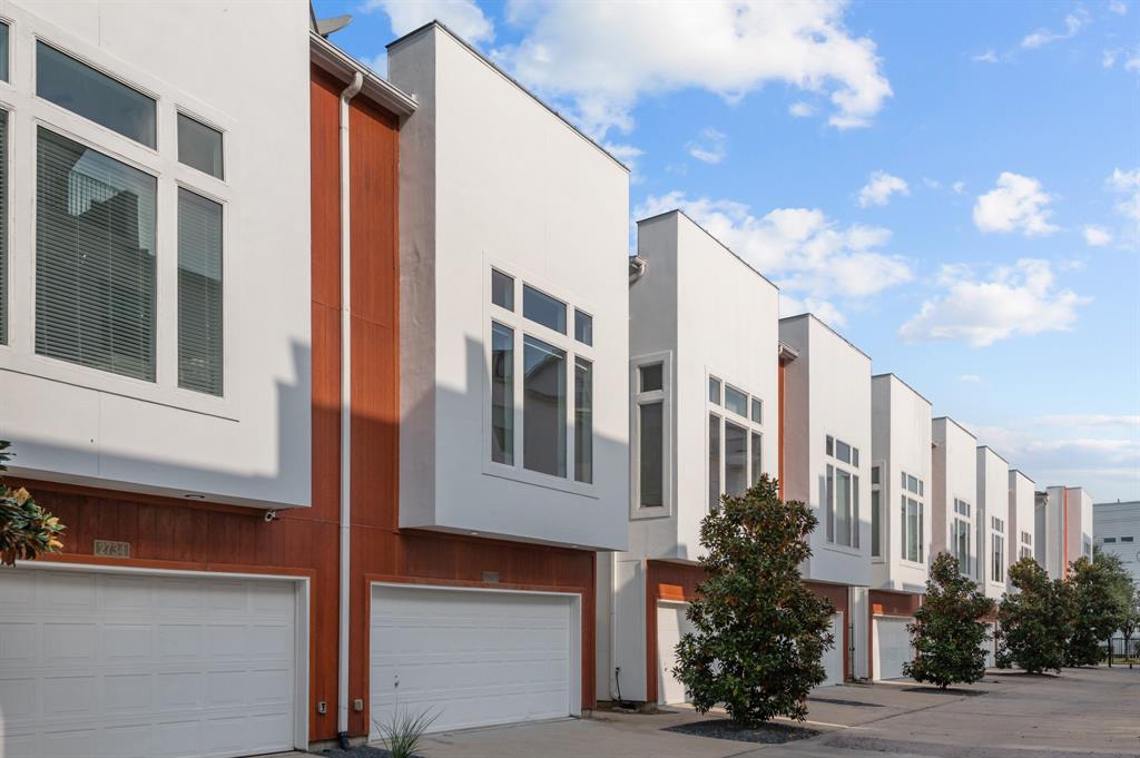 a view of a building with a yard