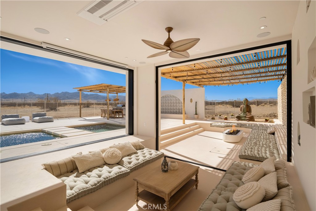 a living room with furniture and a rug