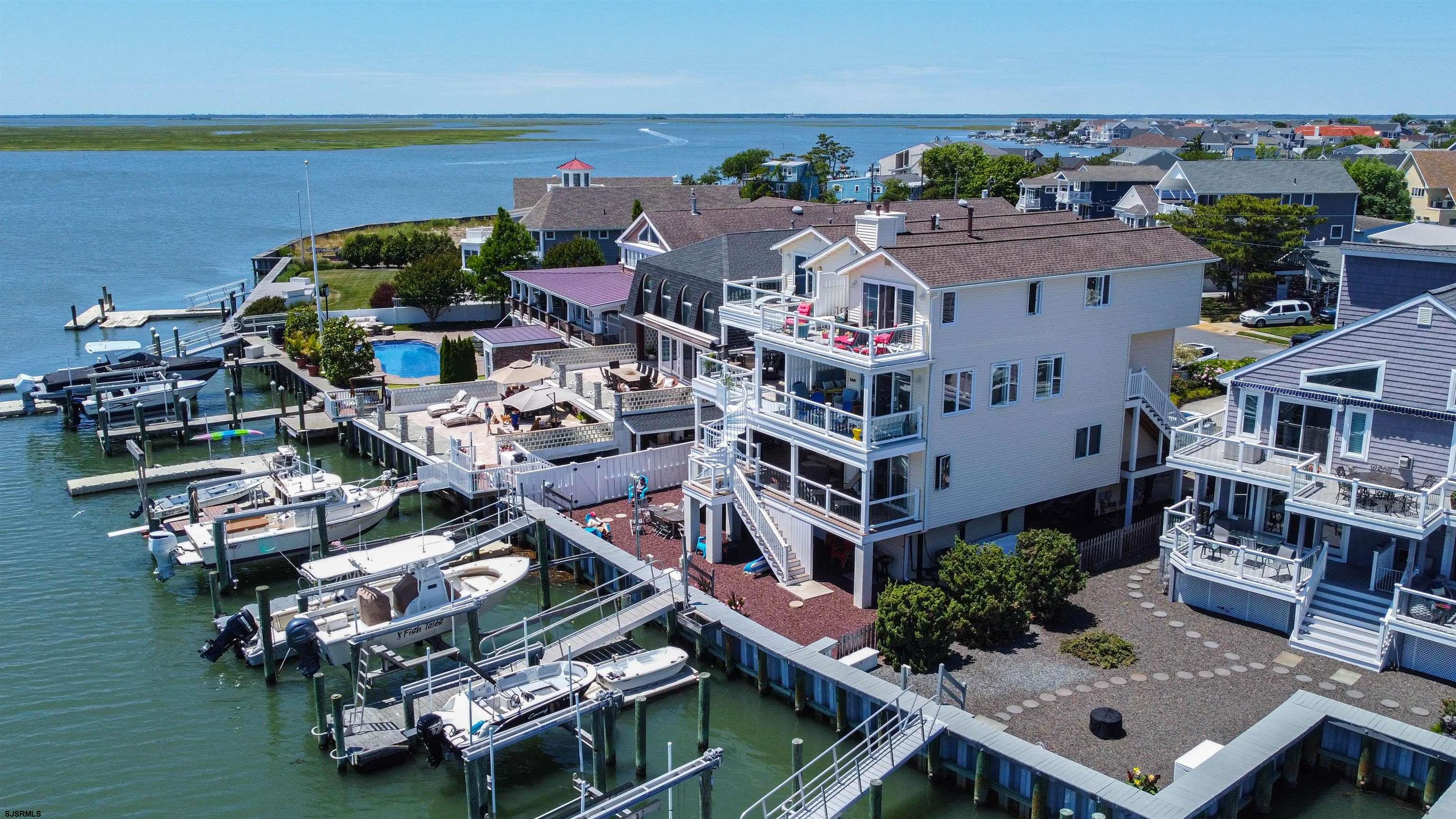 an aerial view of multiple houses with yard