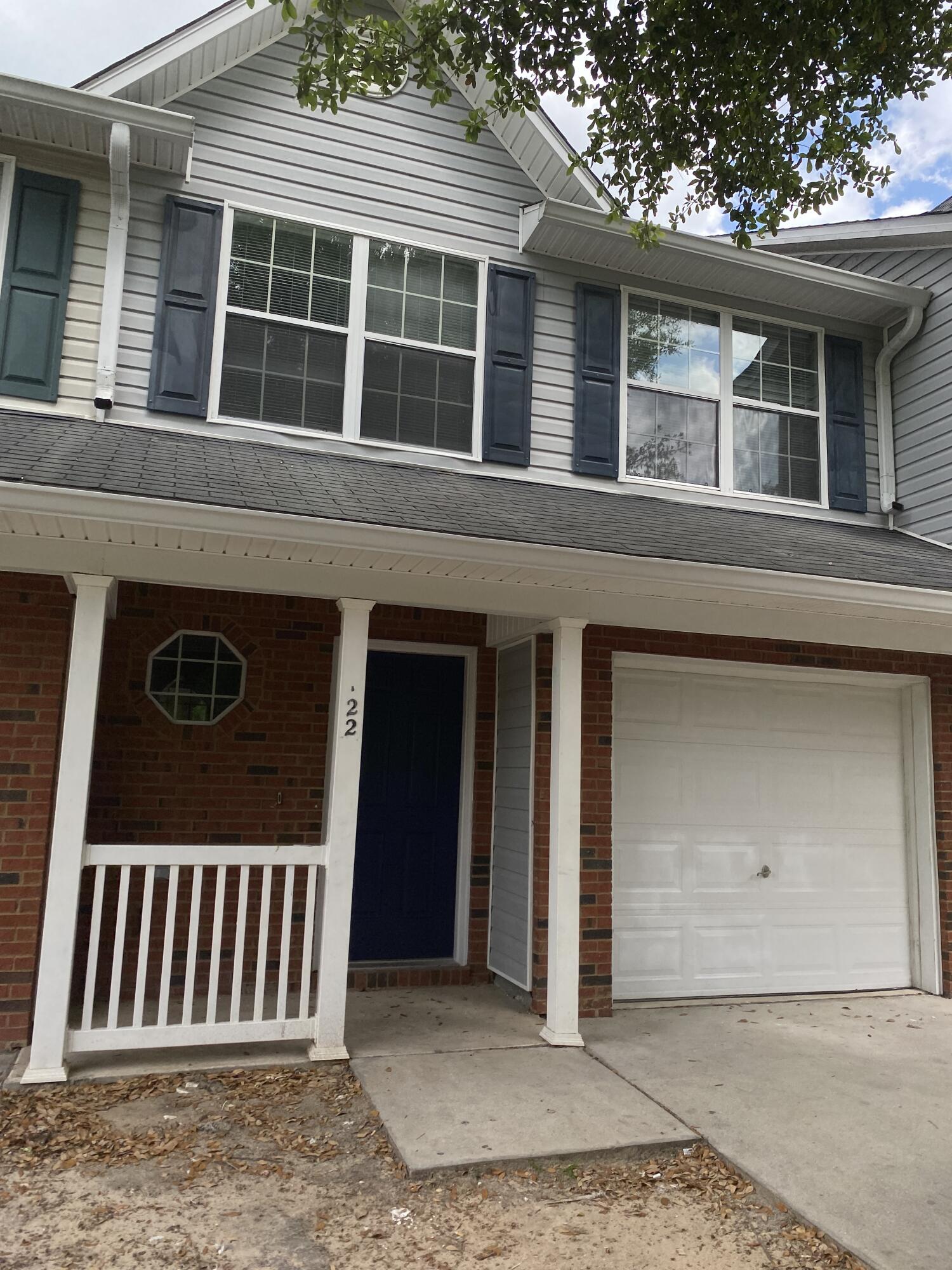 a front view of a house with a porch