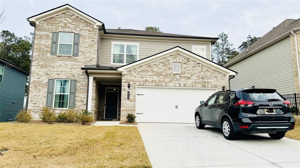 a view of a car in front of a house