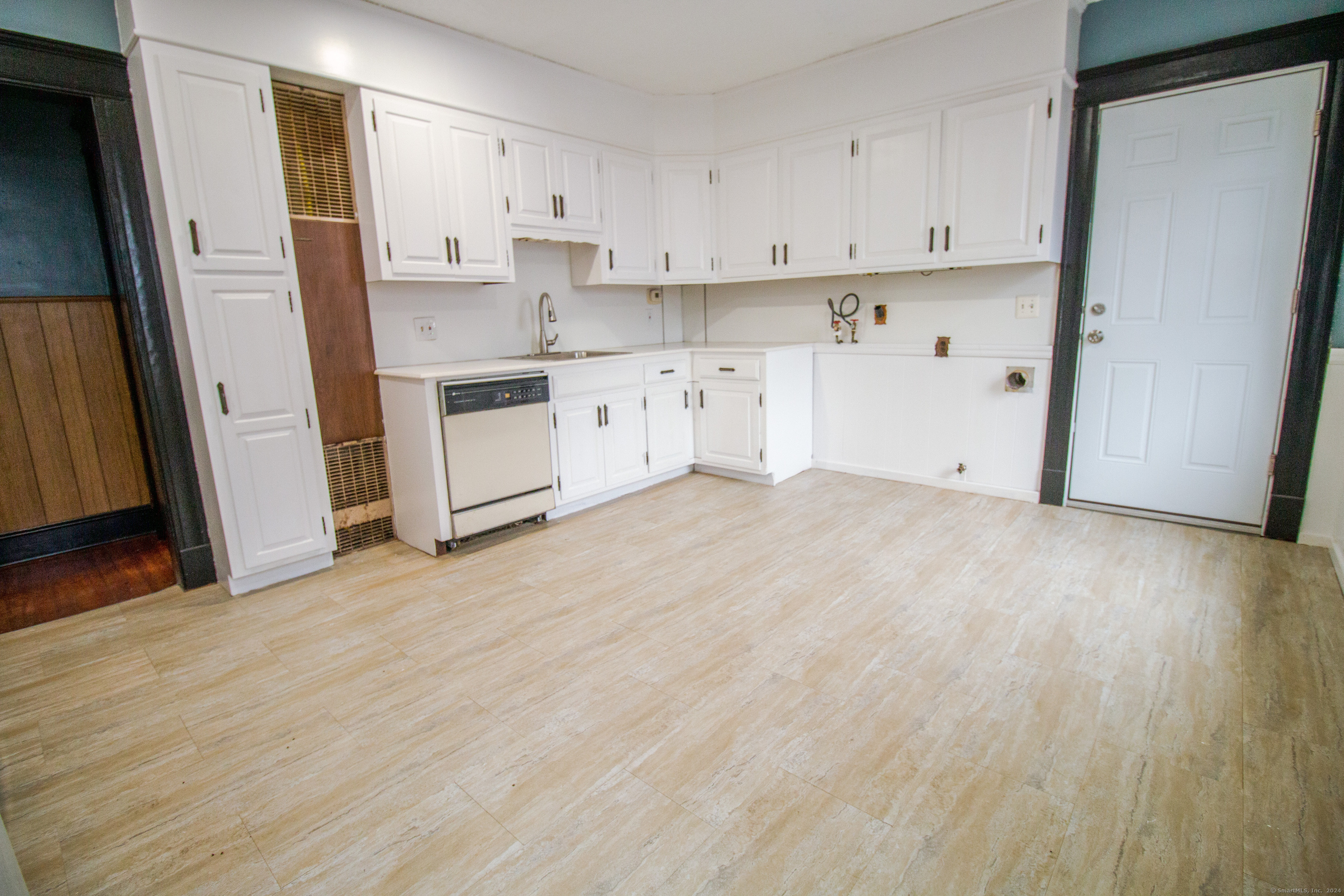 a view of kitchen with wooden floor