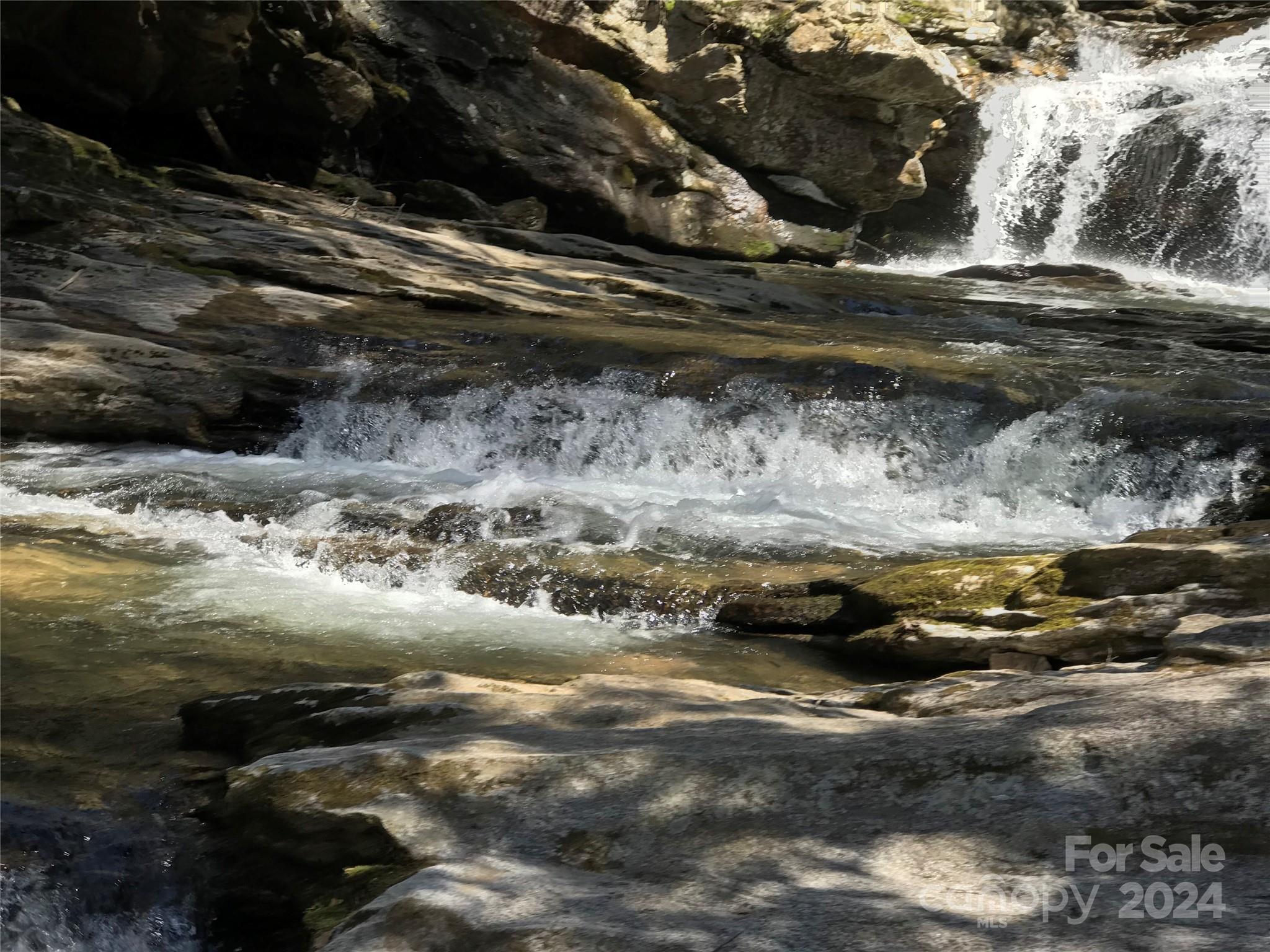 a view of water with water fall