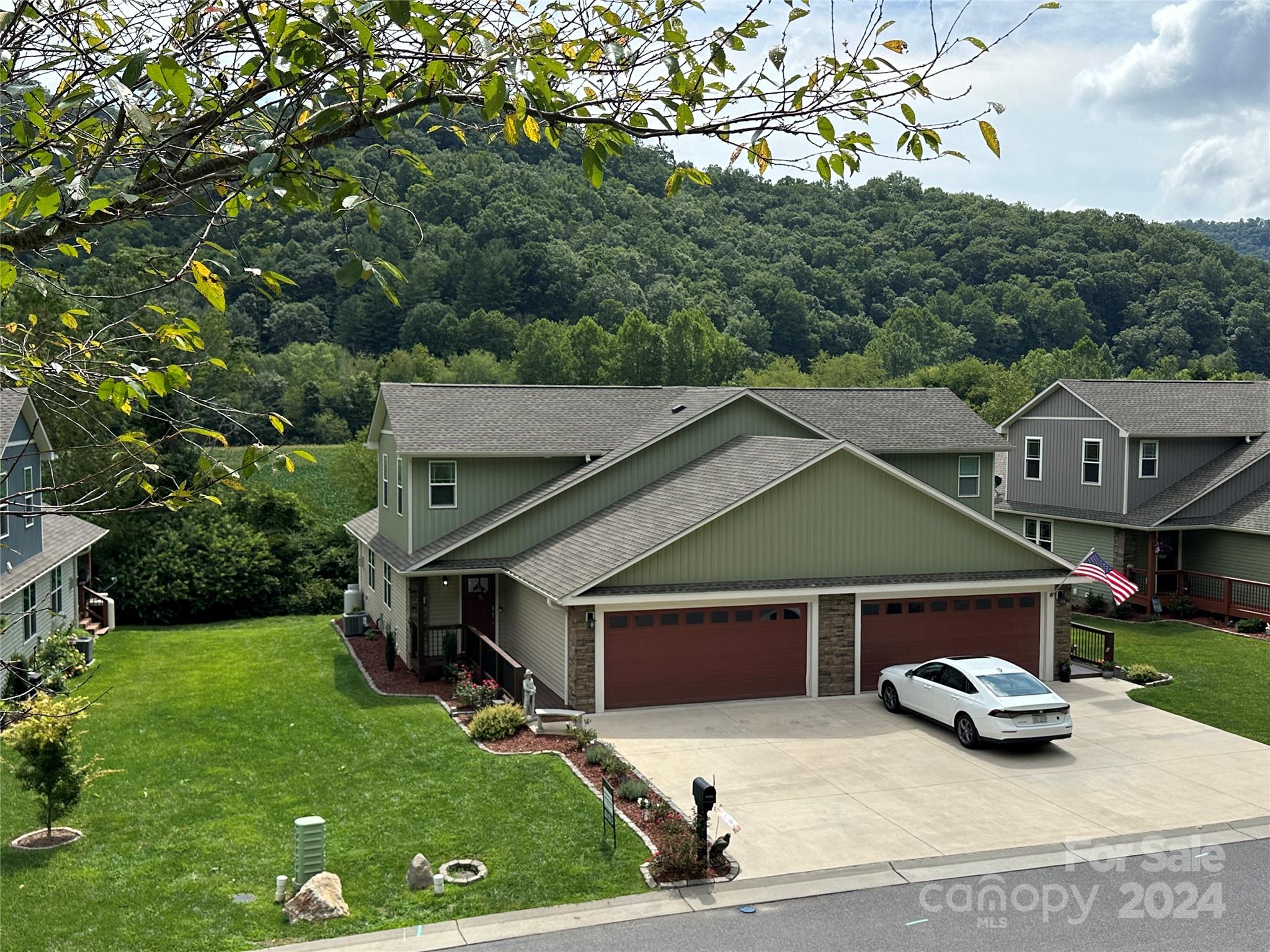 a view of a car parked in front of a house