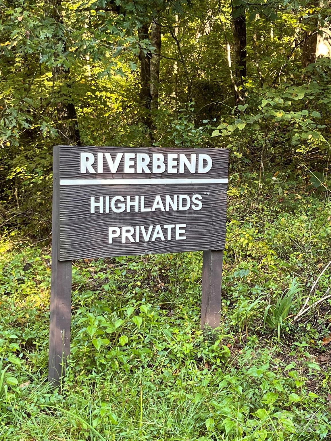 a sign broad in front of red brick house