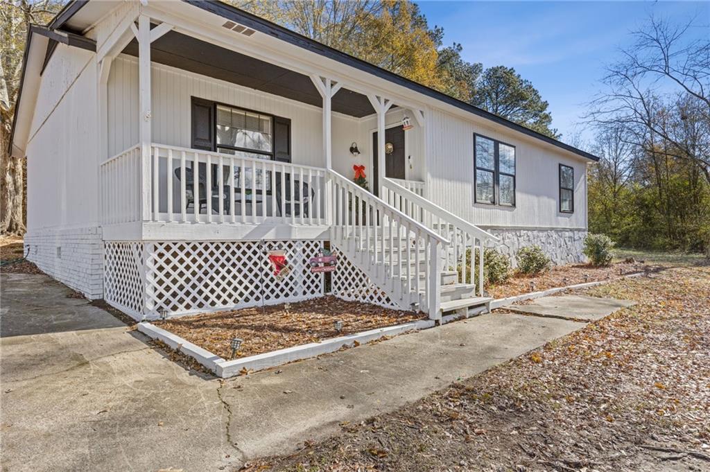 a front view of a house with fence