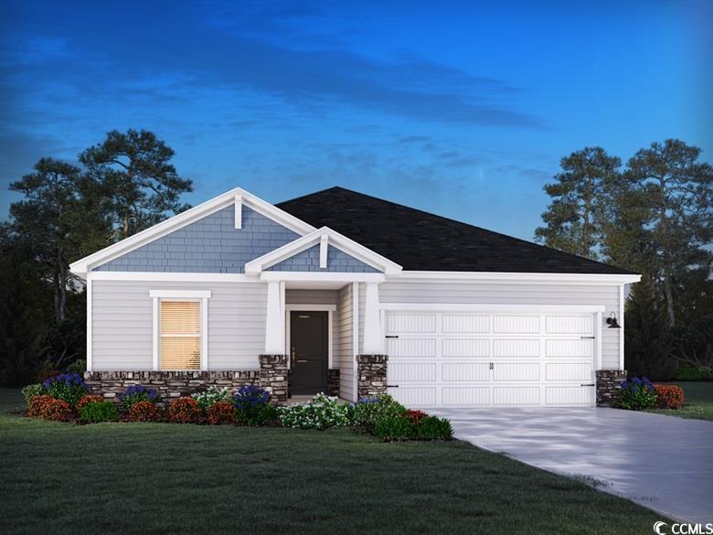 View of front facade with a garage and a front yar