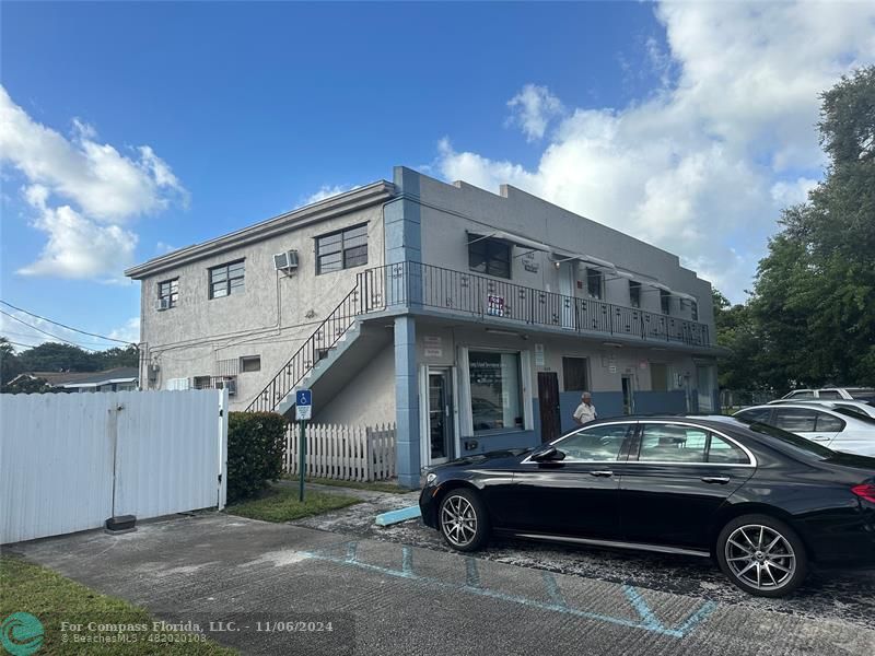 a front view of a house with parking space