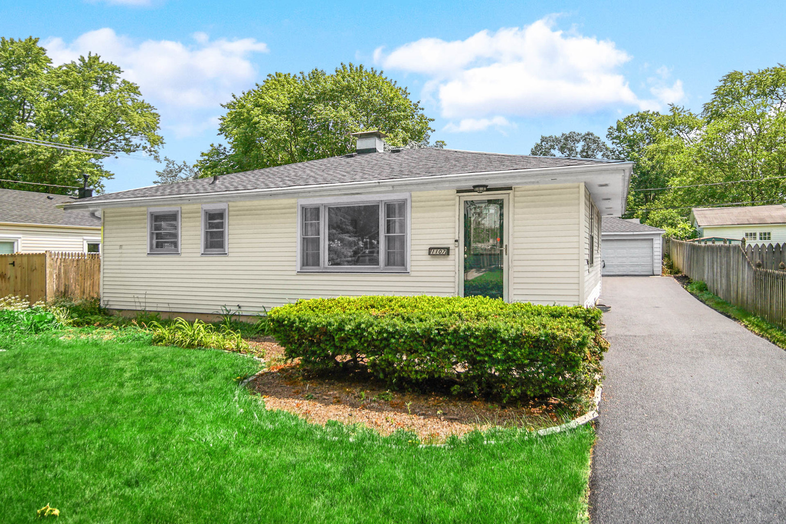 front view of a house with a yard