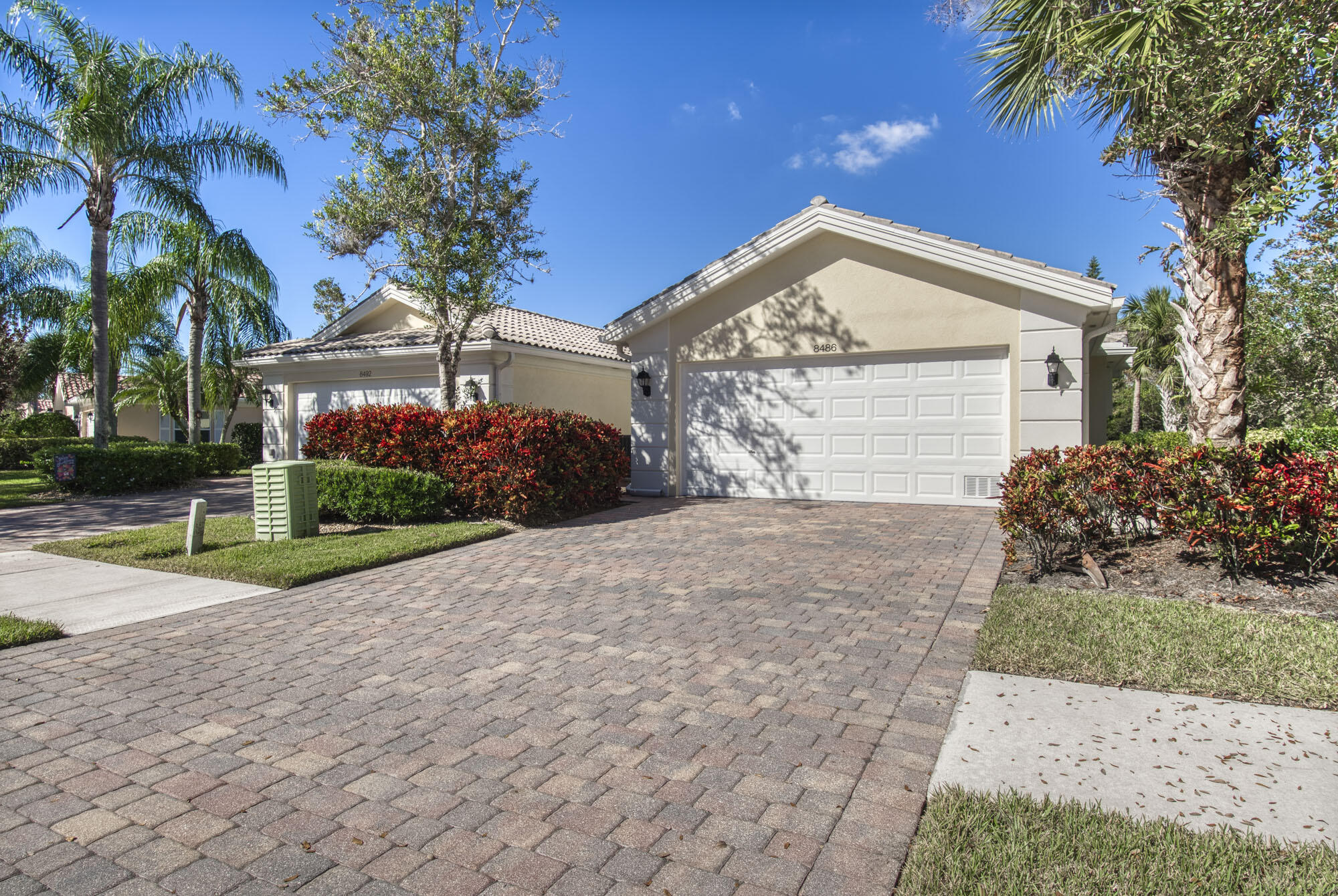 a view of a house with a yard and garage