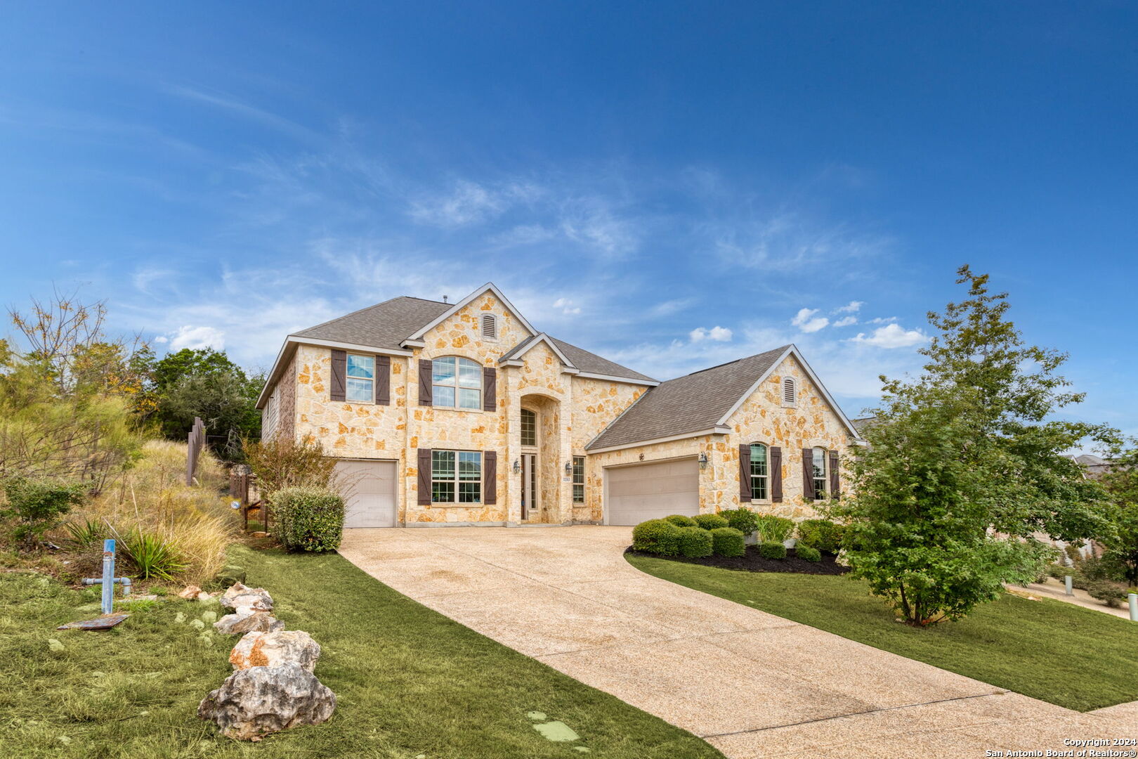 a front view of a house with a yard