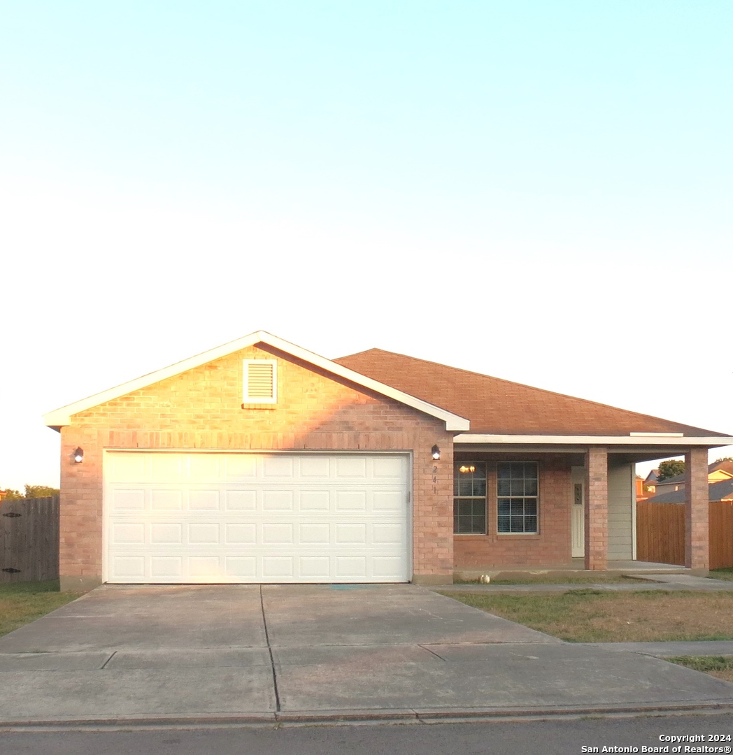 a front view of a house with a garage