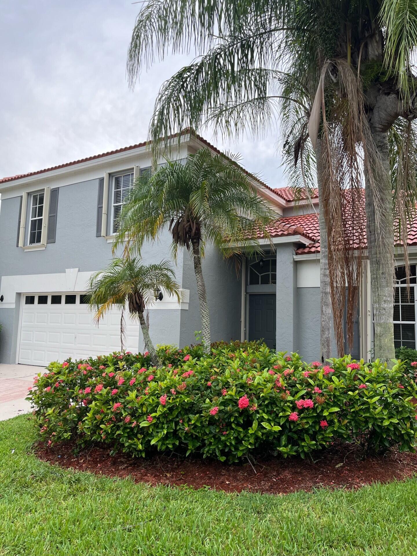 front view of a house with a garden