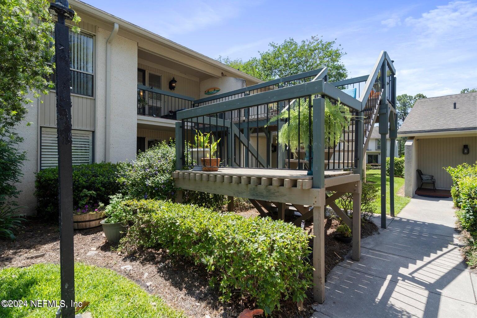 a view of a balcony with plants