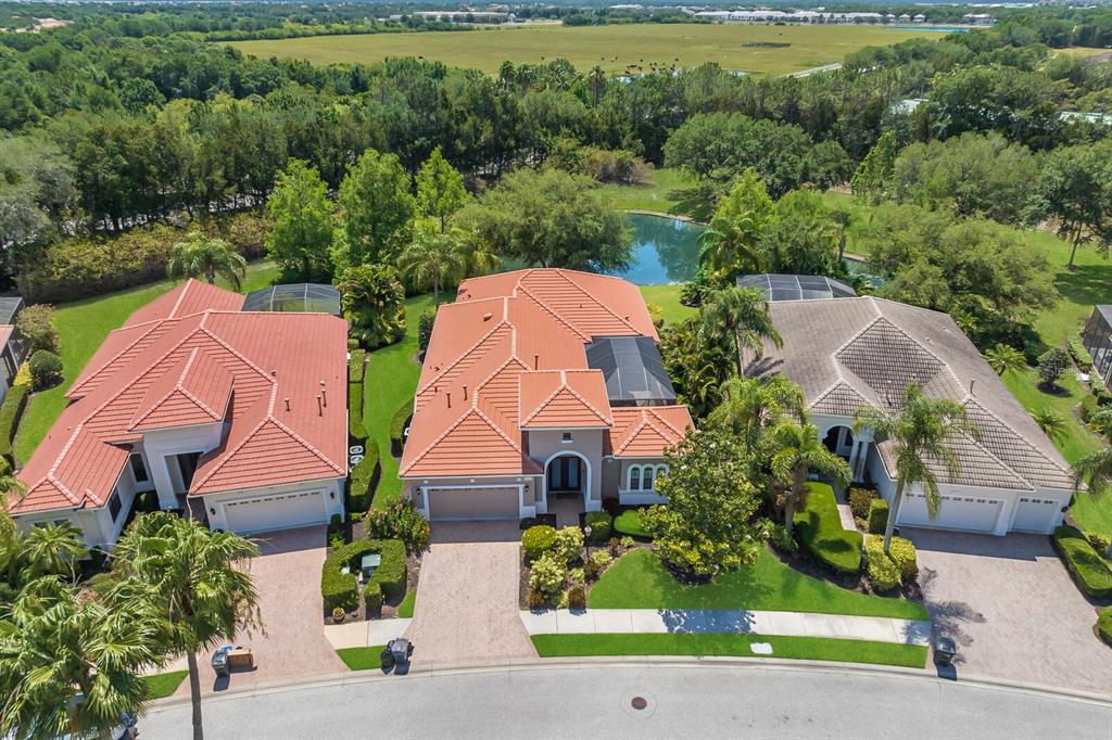 an aerial view of a house with a garden and plants