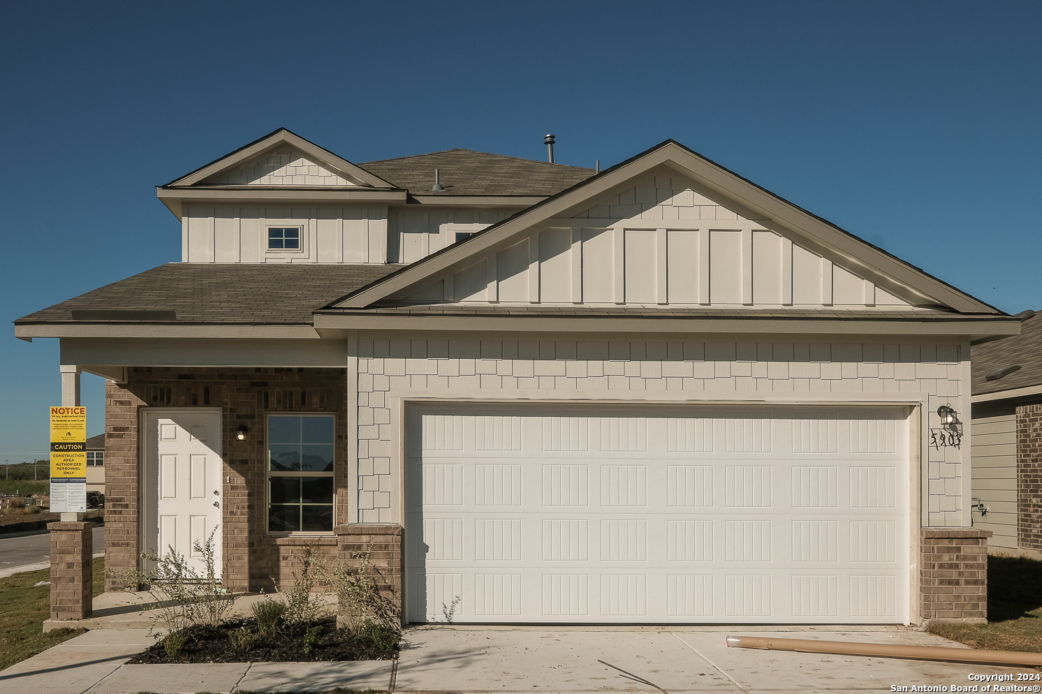 a front view of a house with garage