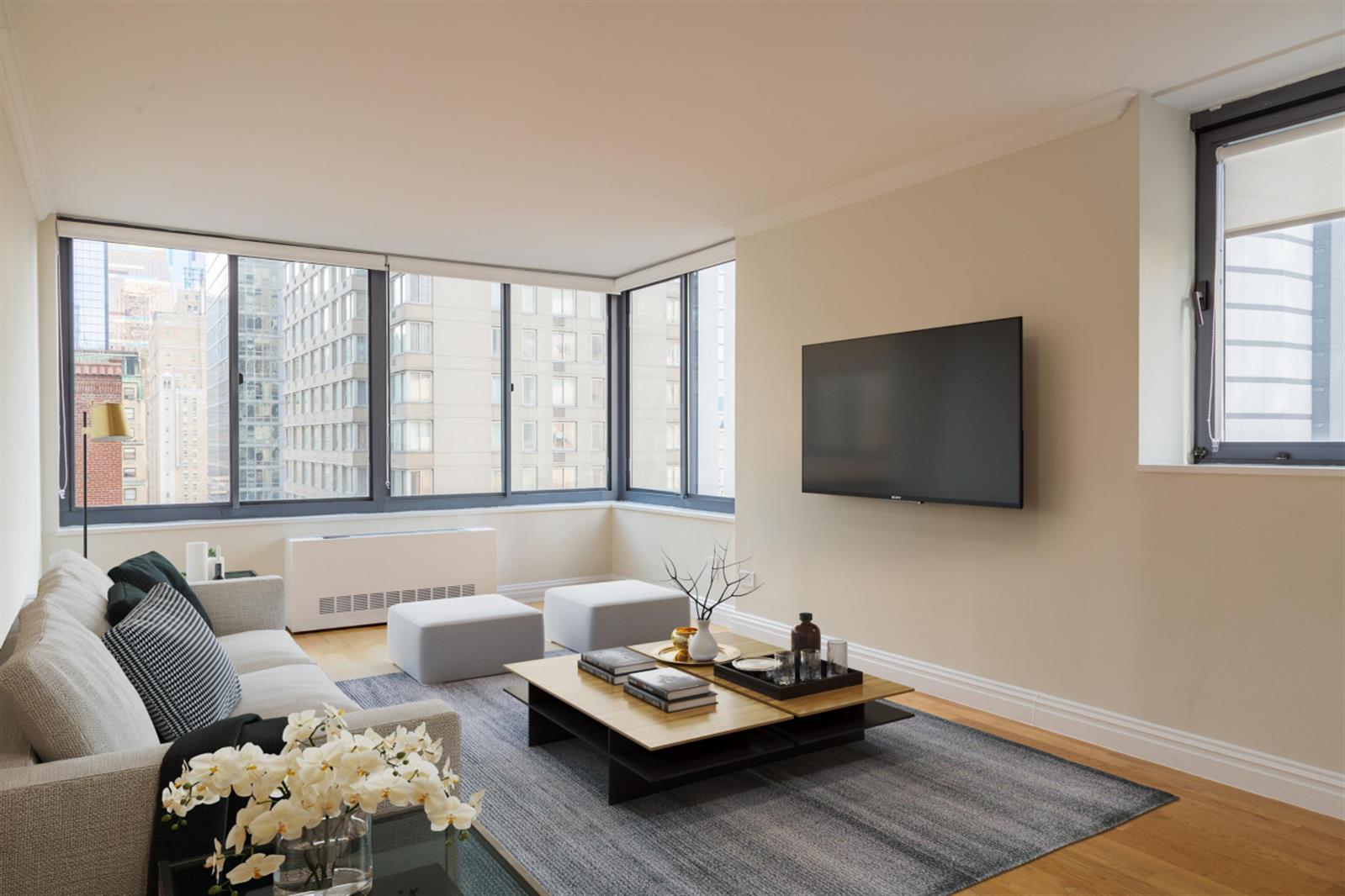 a living room with furniture and a flat screen tv