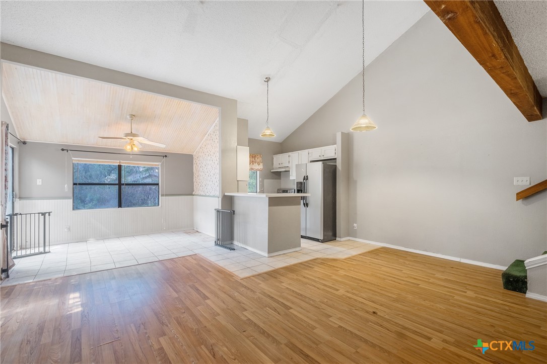 a view of kitchen with furniture and wooden floor