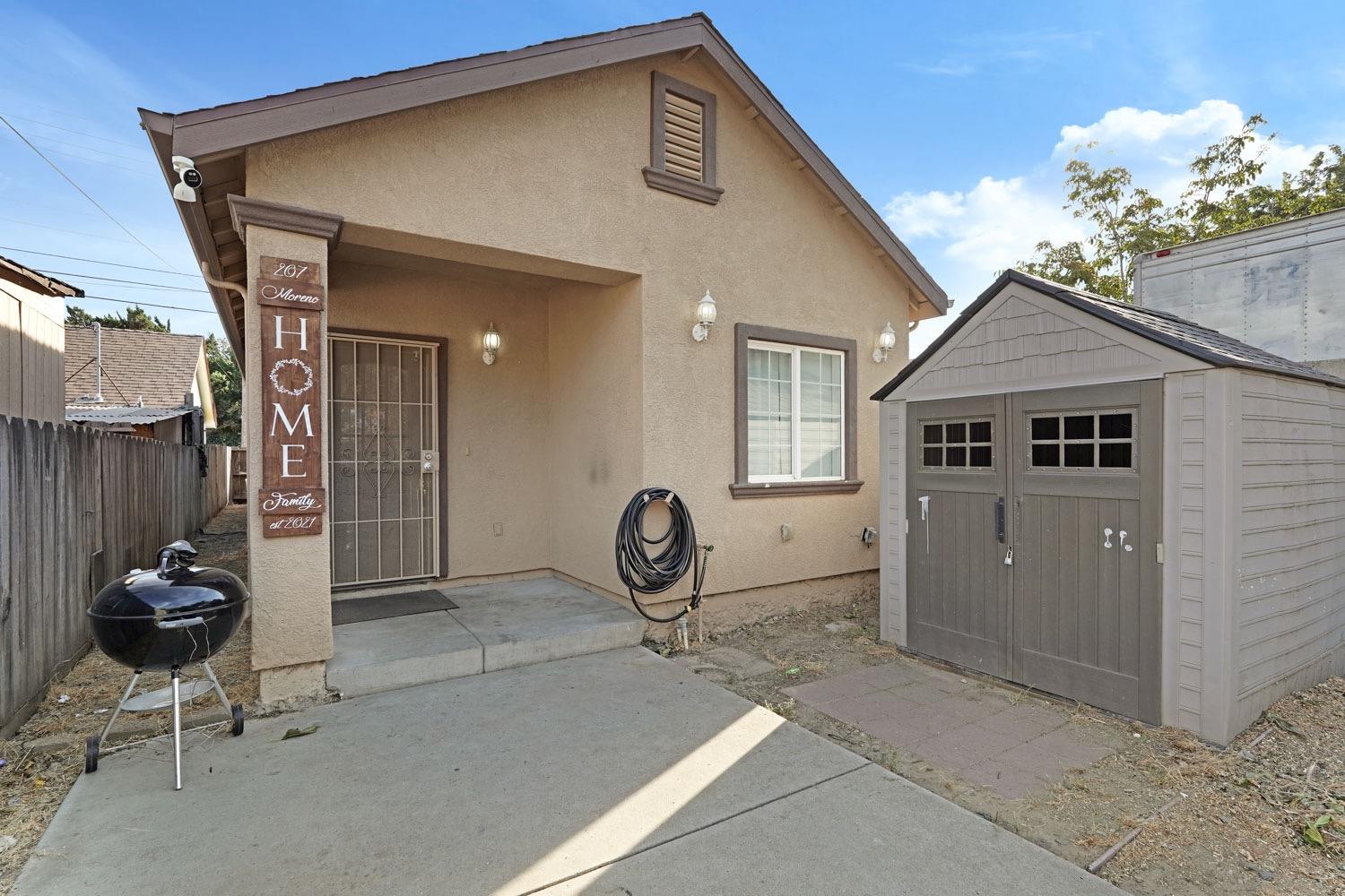 a front view of a house with patio