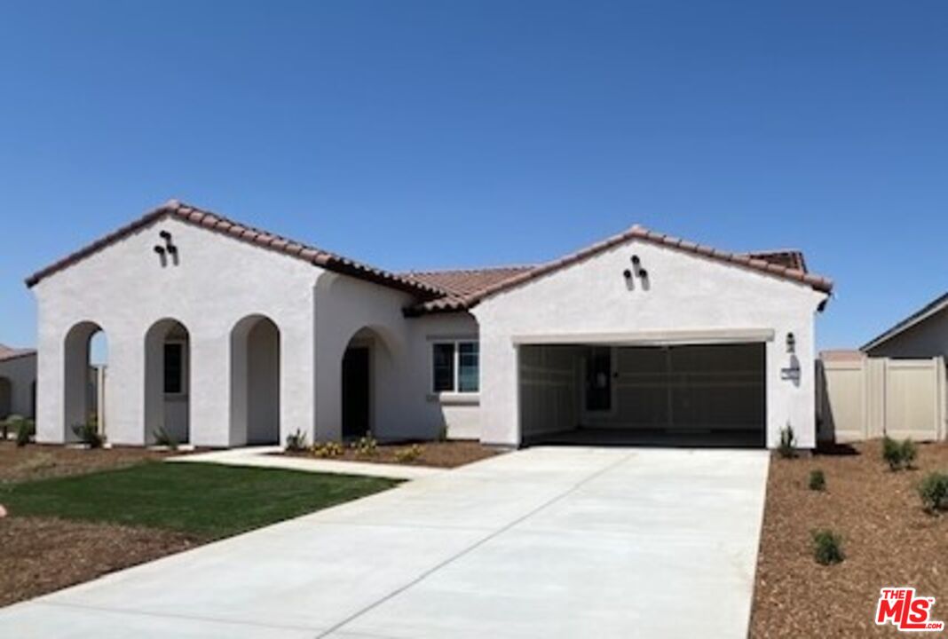 a front view of a house with yard