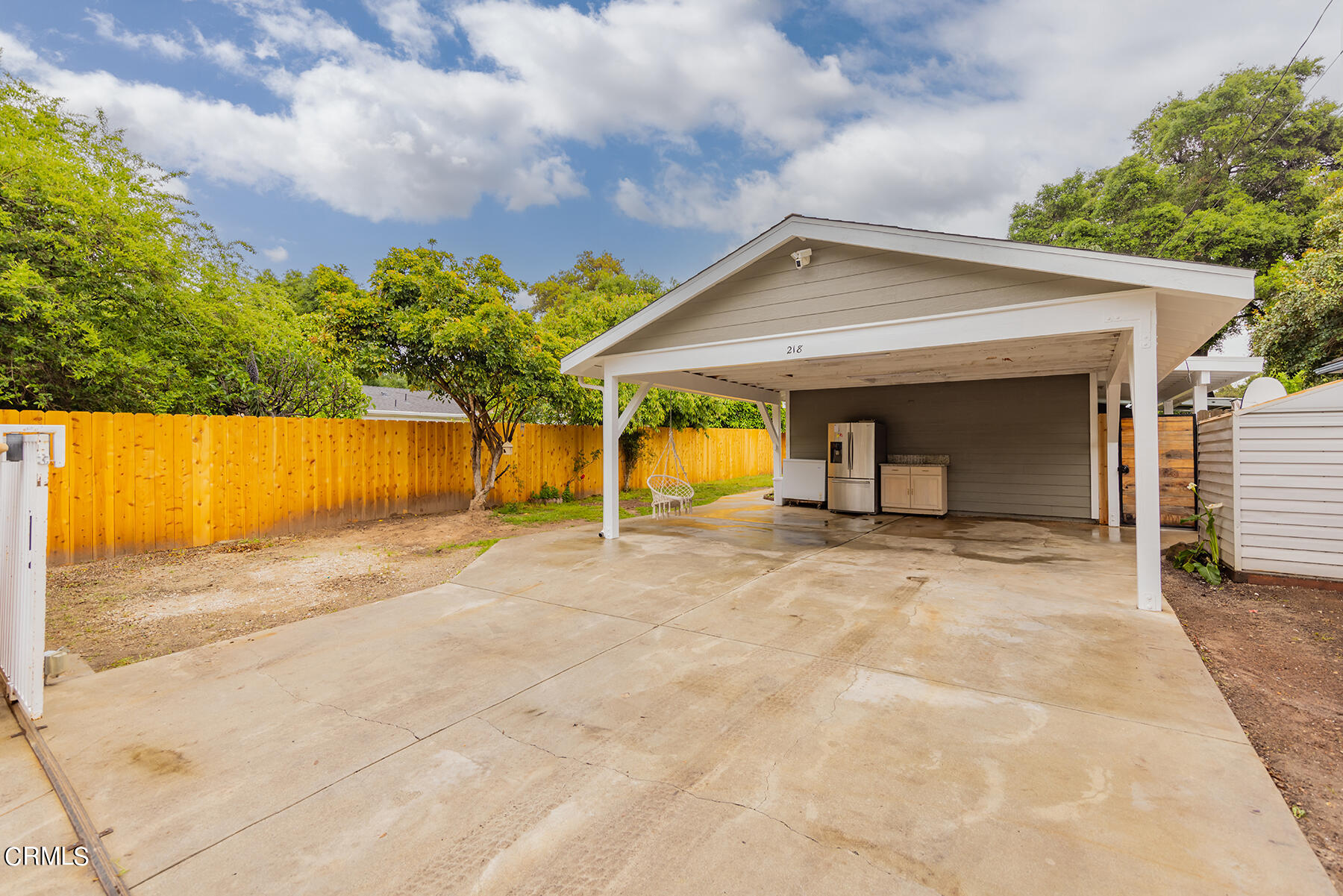 a view of a house with backyard and garage