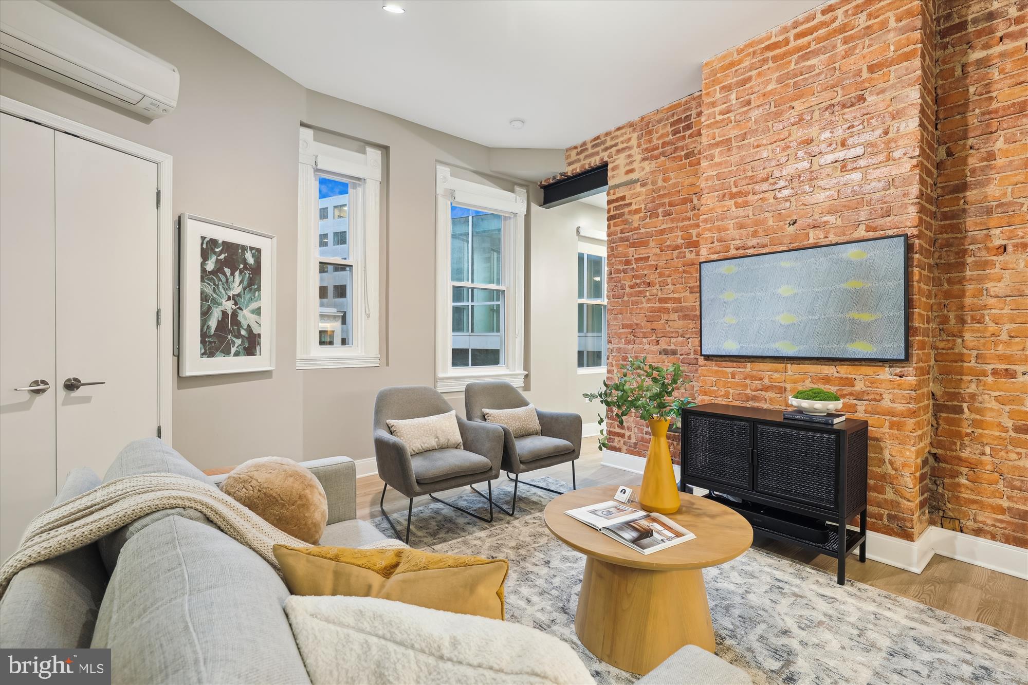 a living room with furniture and a flat screen tv