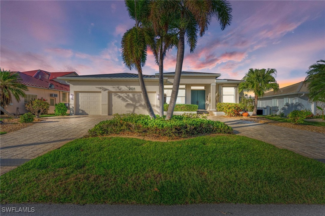 a front view of house with yard and green space