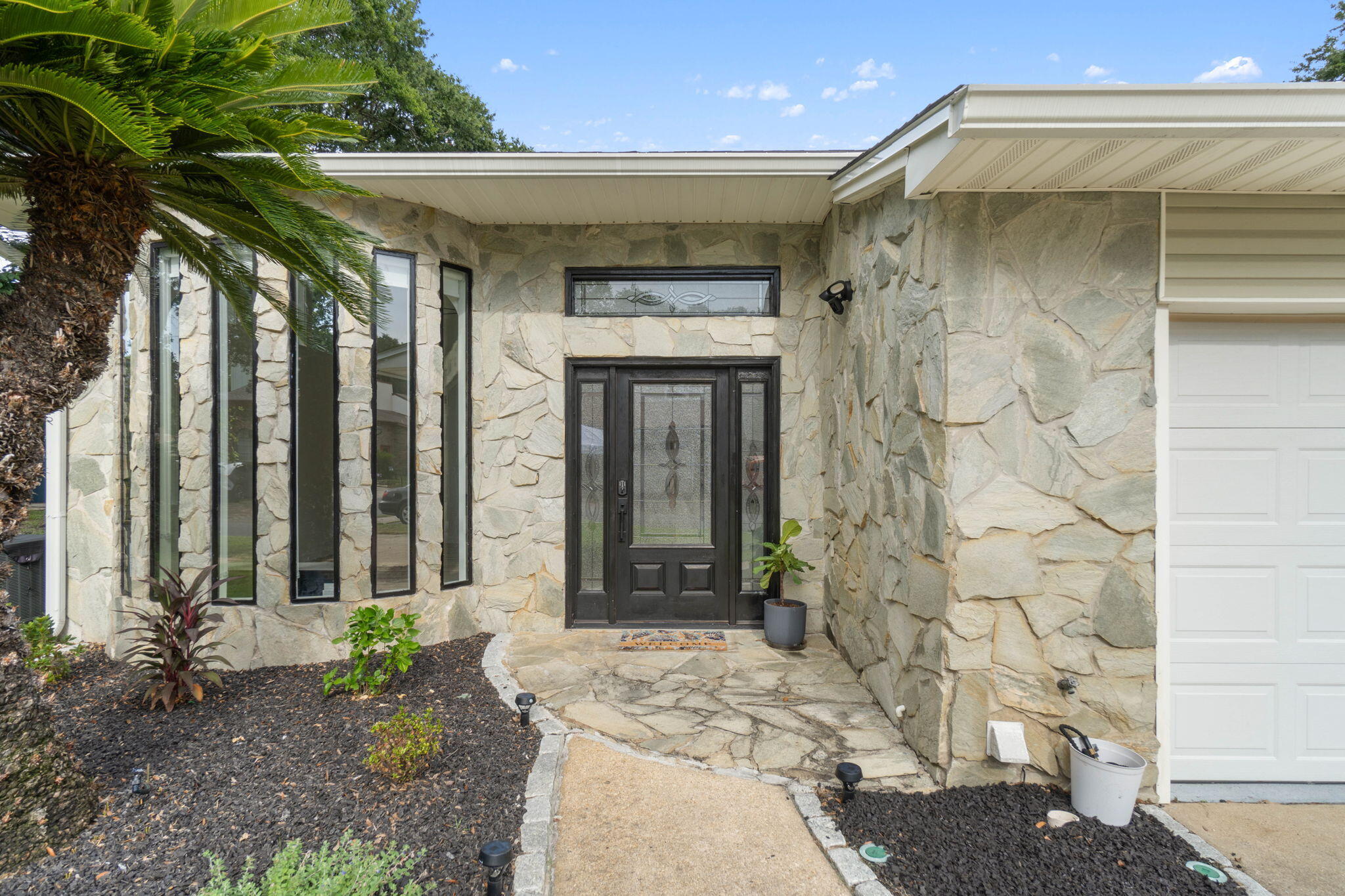 a front view of a house with a glass door