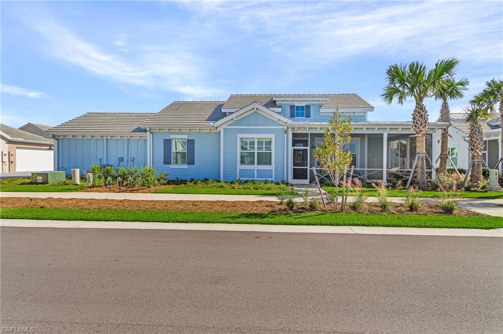 View of front of home featuring a sunroom