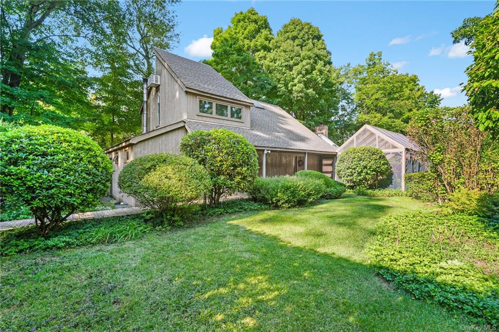 a house that has a tree in front of it