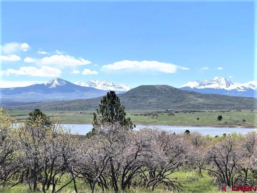 a view of a lake with mountain in the background