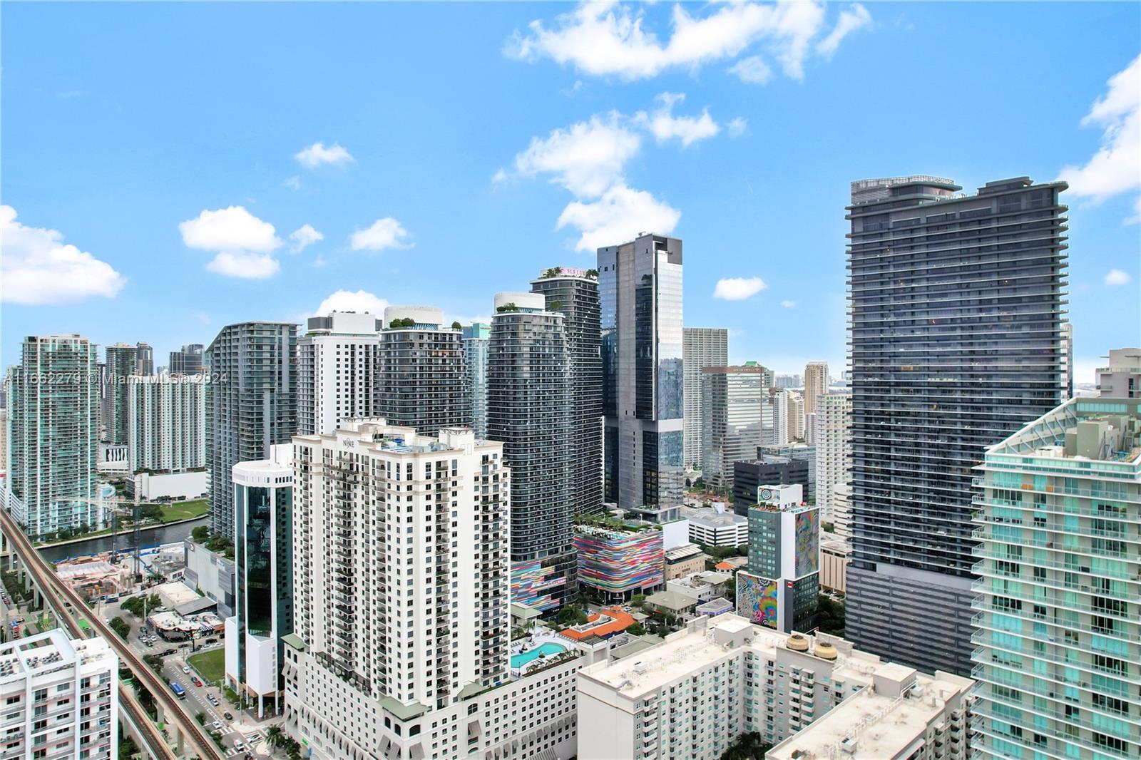 a view of city with tall buildings