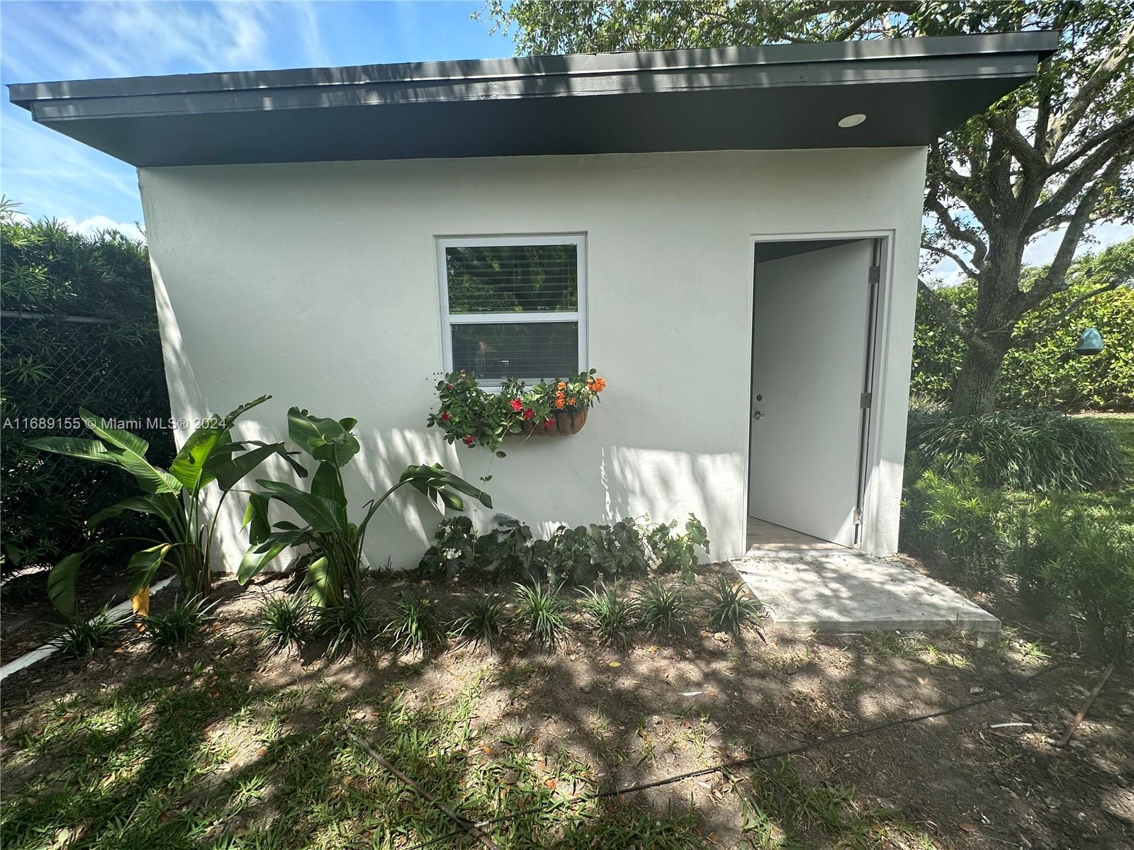 a view of a house with a plant