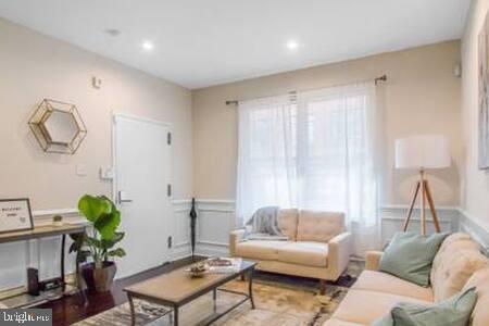 a living room with furniture and a window