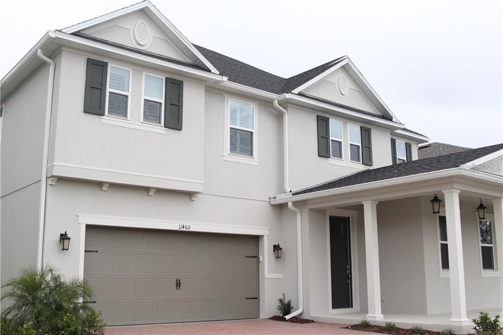 a front view of a house with garage