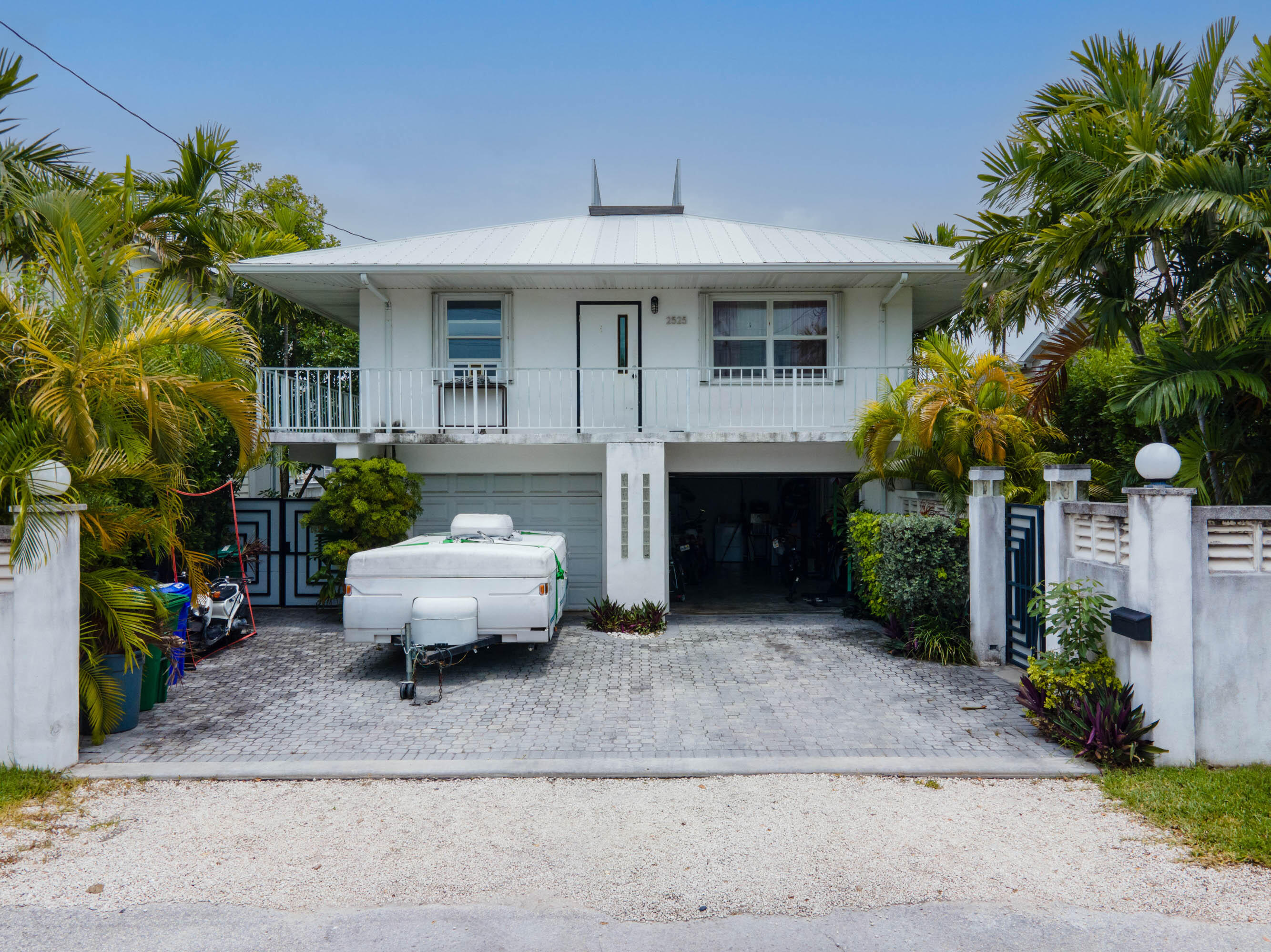 a front view of a house with sitting area