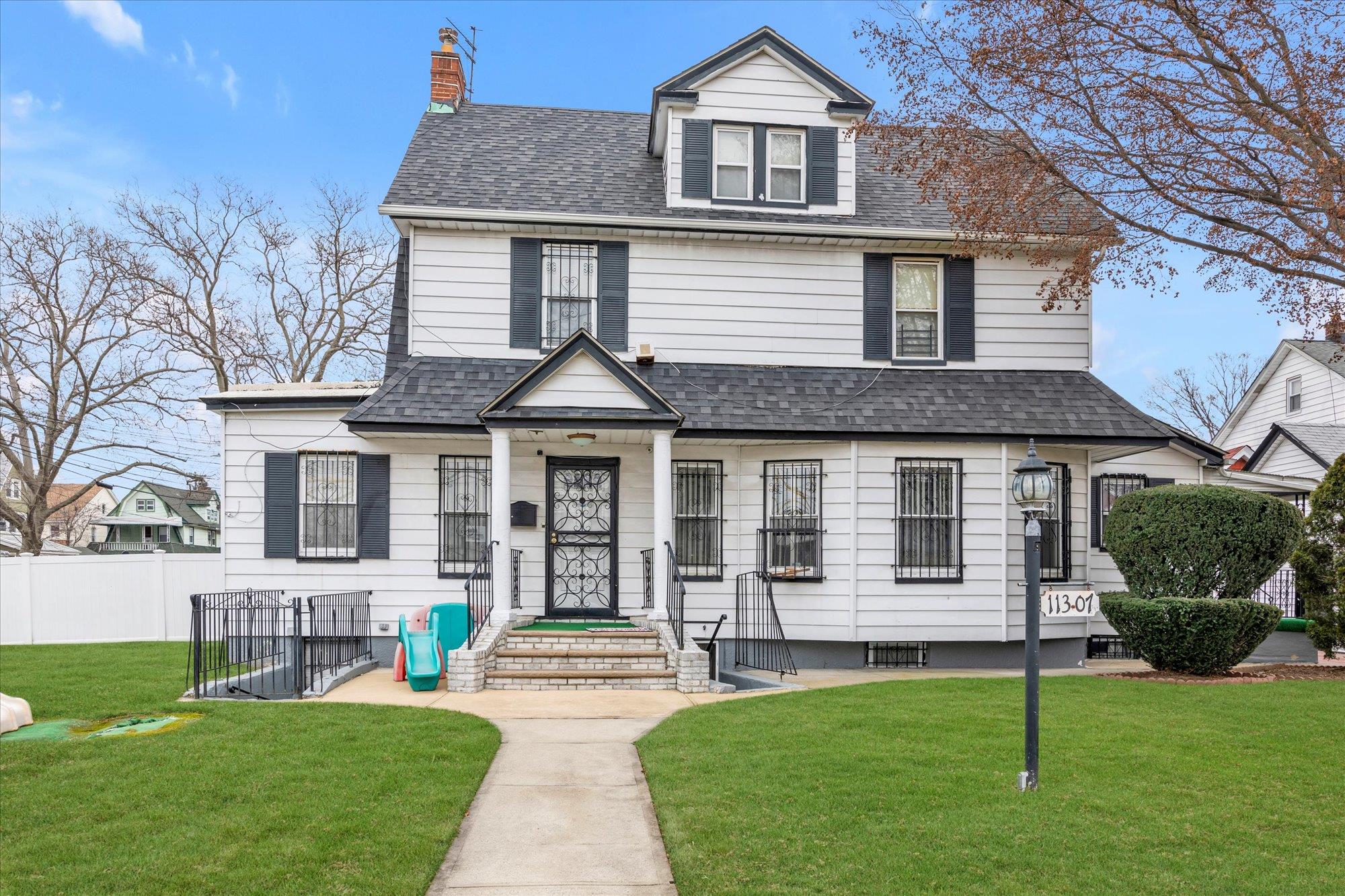 View of front of property with a front lawn