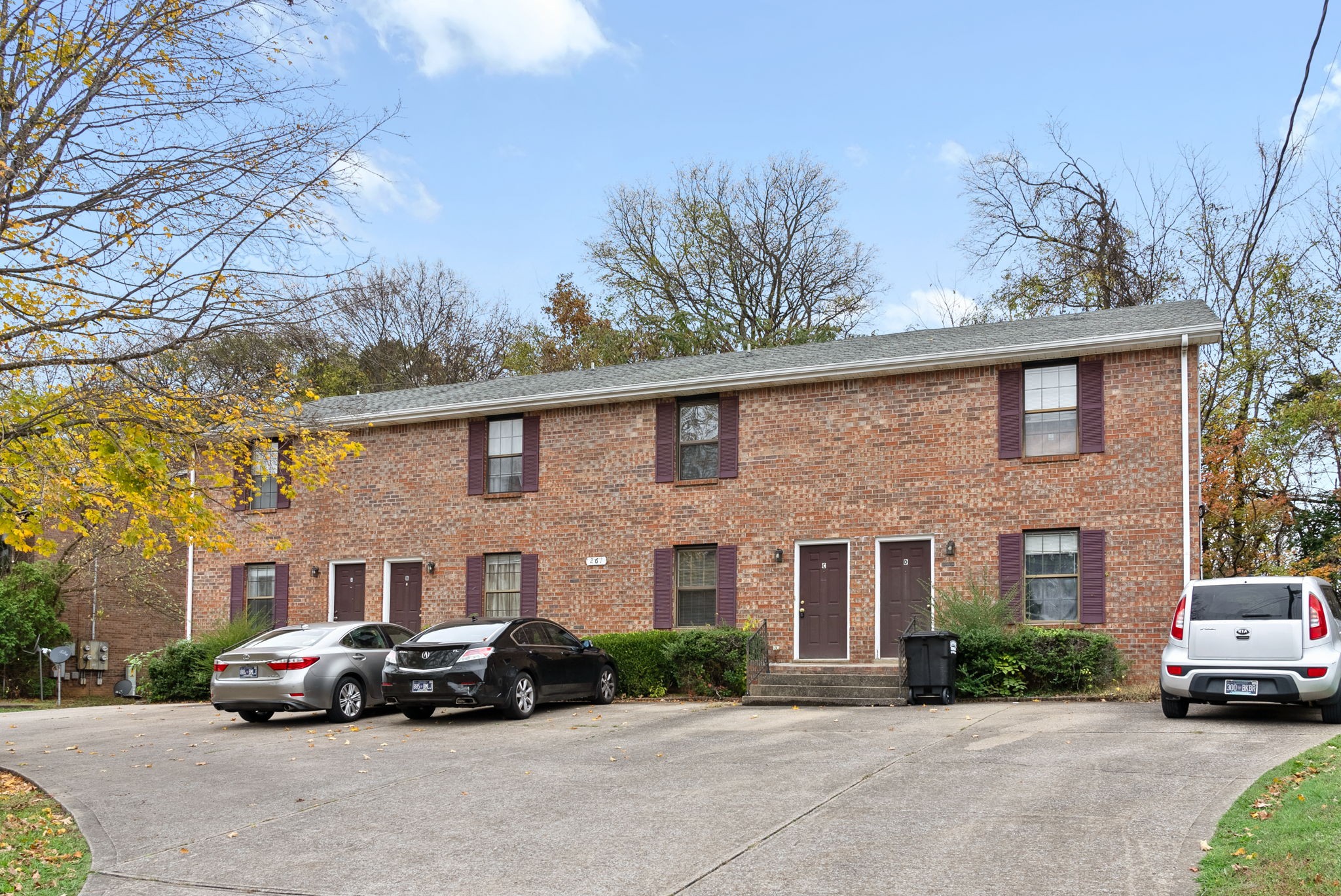 a car parked in front of a brick building