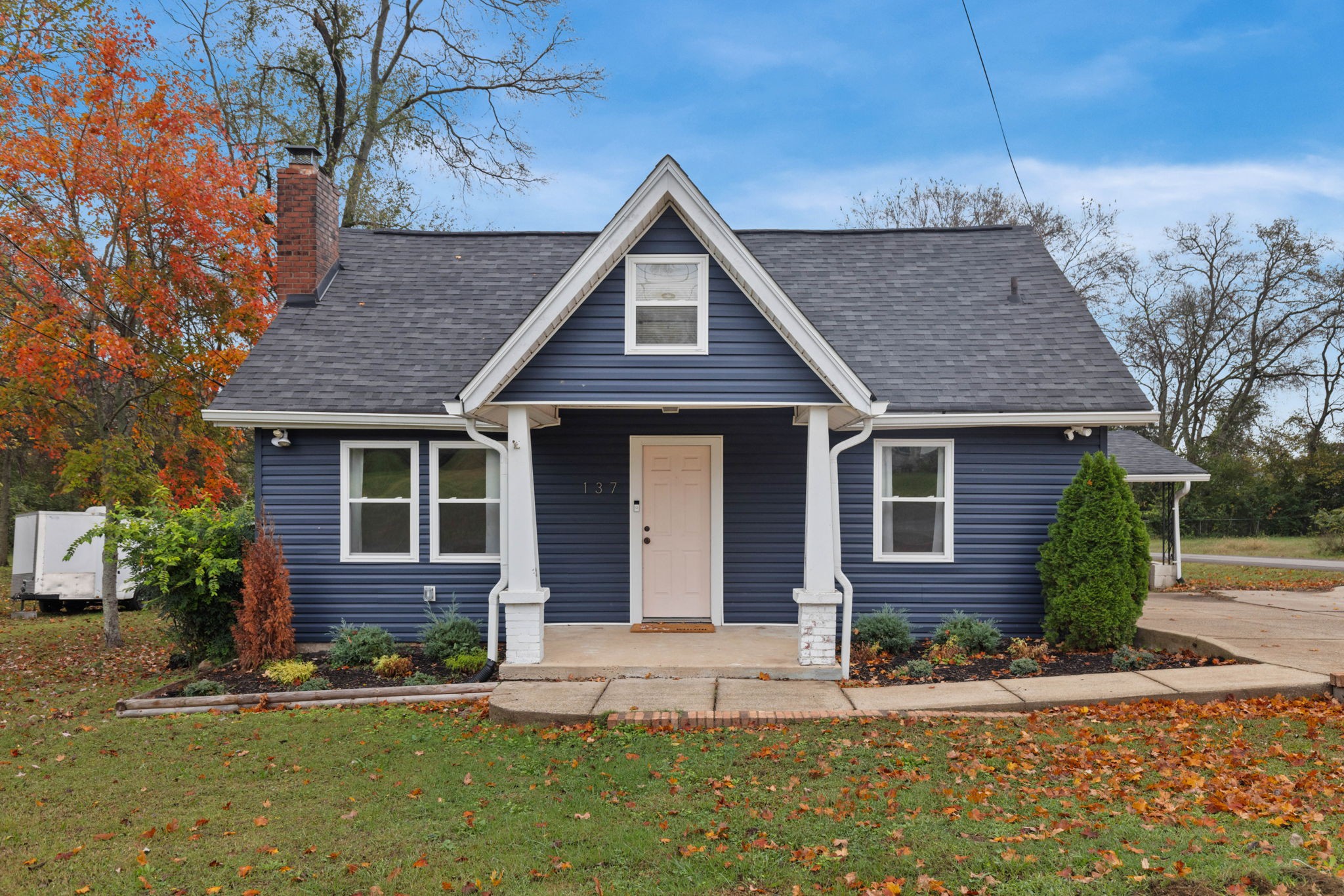 a front view of a house with a yard