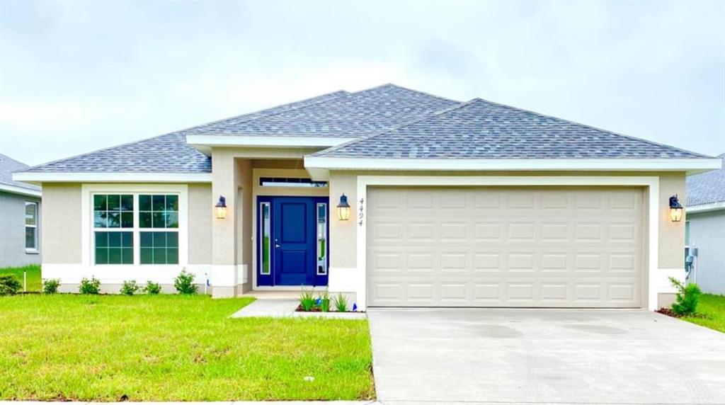 front view of a house with a yard