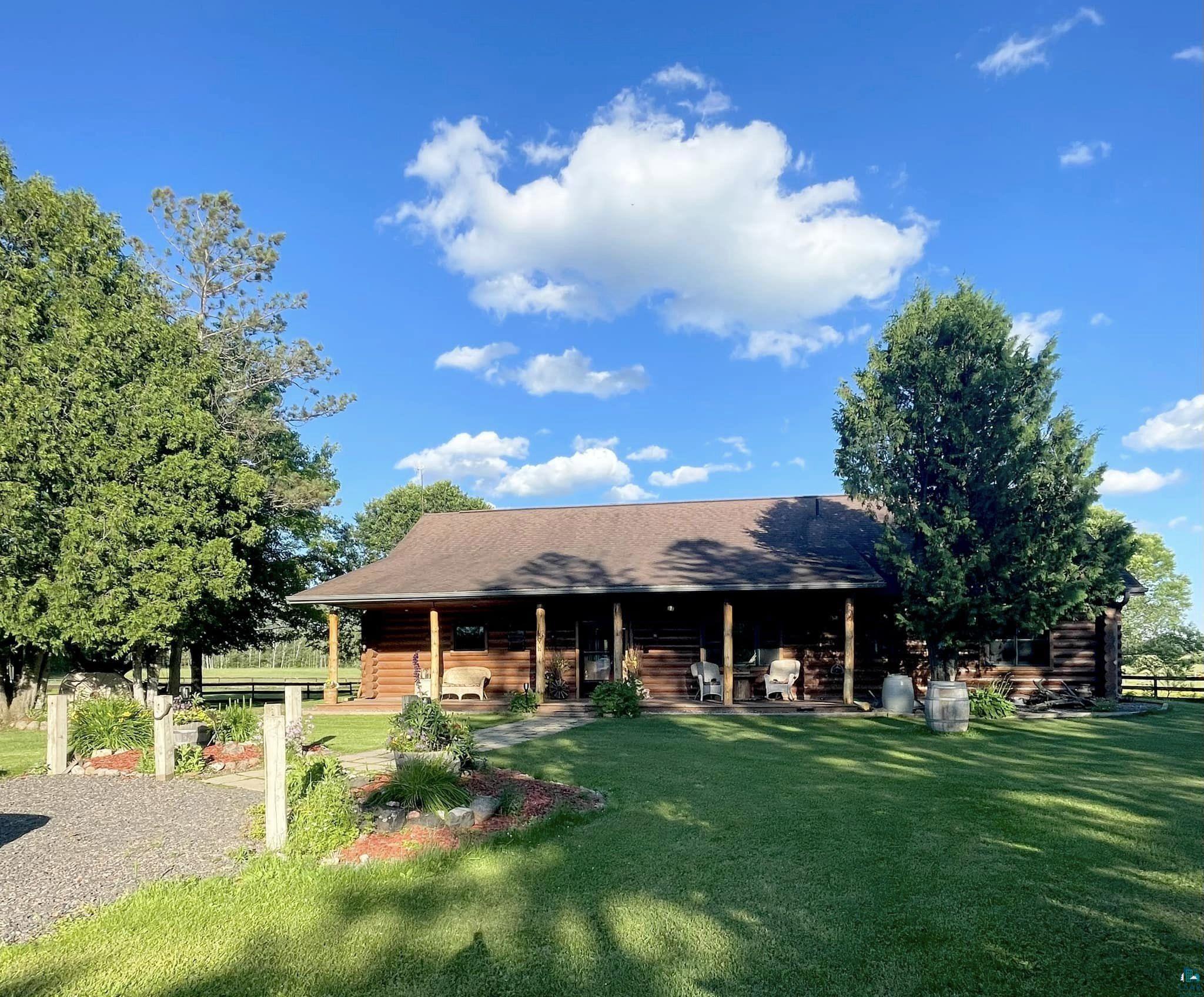 Log Home with beautiful covered porch